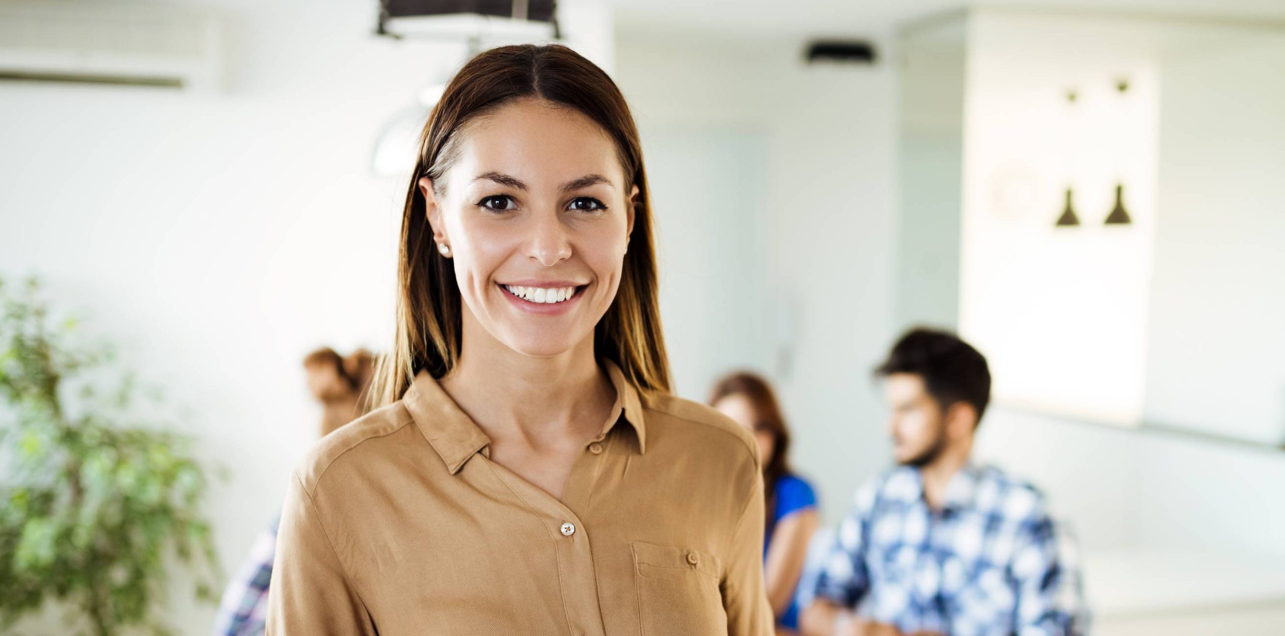 Businesswoman holding tablet at conference tablet having company meeting.
