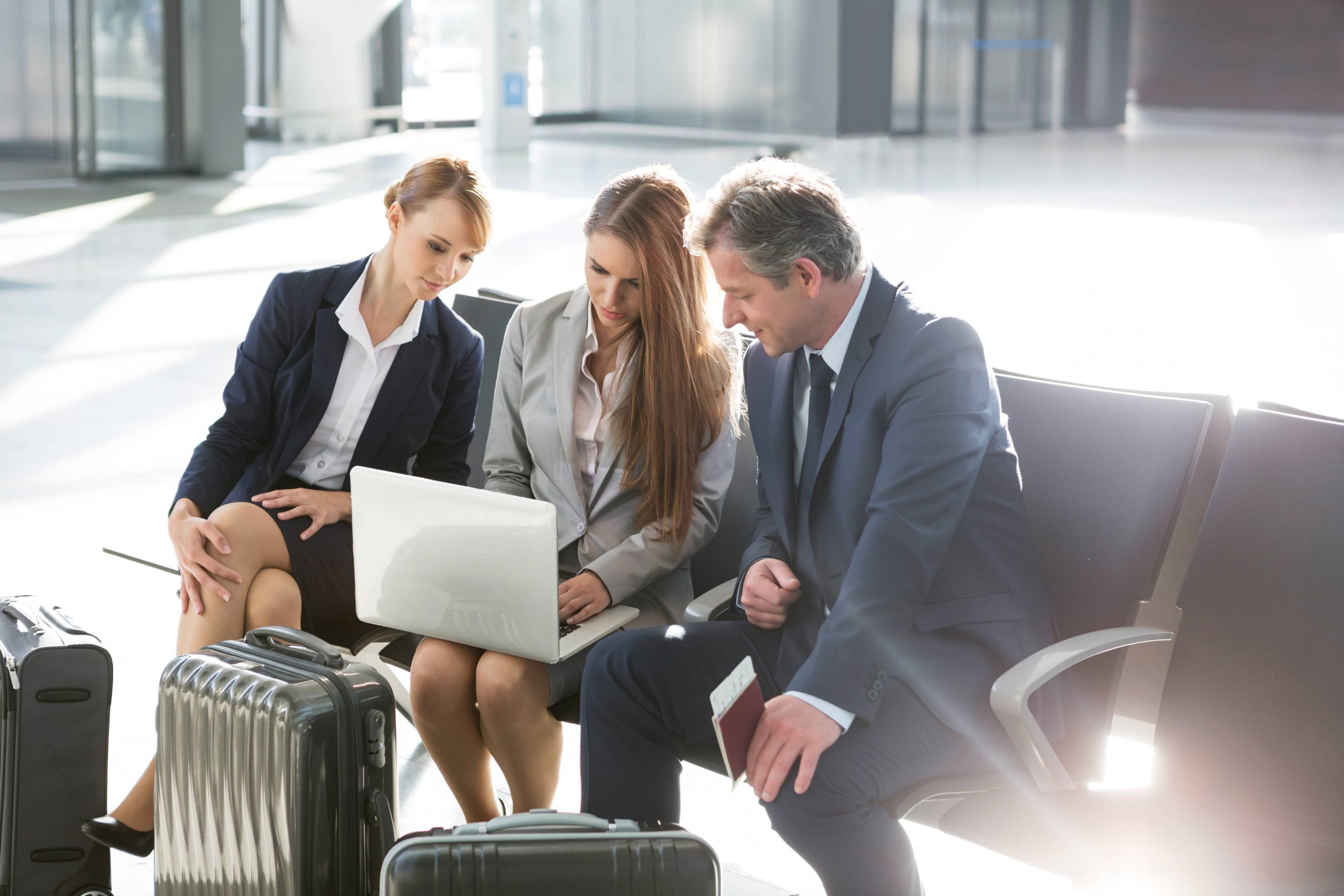 Business people working while waiting for boarding in the airport.